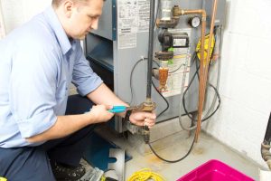 HVAC technician fixing heating system Weatherford, TX